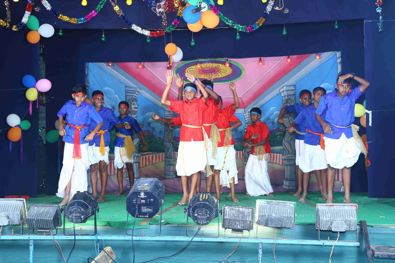 Boys performing a group dance on stage